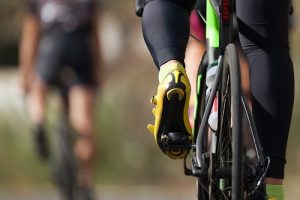 How to Clean Your Peloton Cycling competition cyclist athletes riding a race at high speed, detail of cycling shoes