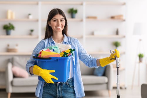 woman cleaning with home disinfectant spray