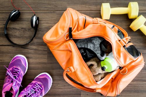 clean your gym bag with disinfectant spray